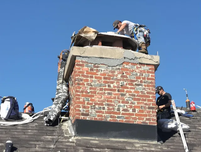Windham Chimney Sweep installing a custom chimney crown in Windham, CT