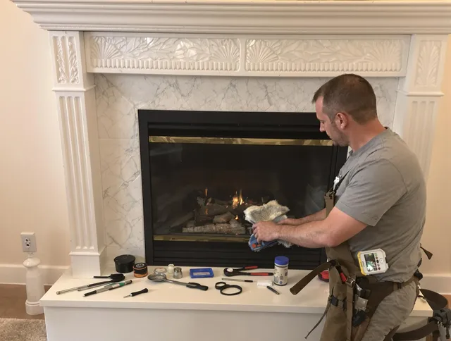 Windham Chimney Sweep performing fireplace maintenance in Windham, CT