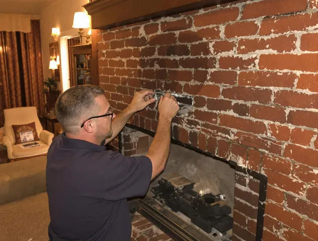 Windham Chimney Sweep expert fixing a fireplace in Windham, CT